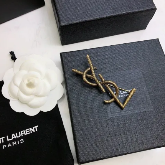 Saint Laurent Cassandre Twisted Monogram Brooch brooch antique brass gold metal no gemstones 4 5cm width
