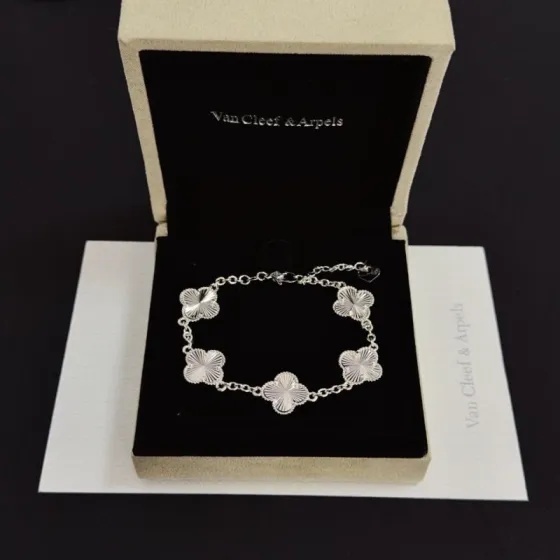 Van Cleef Arpels Alhambra bracelet silver-toned metal with guilloche engraved clover motifs 19cm