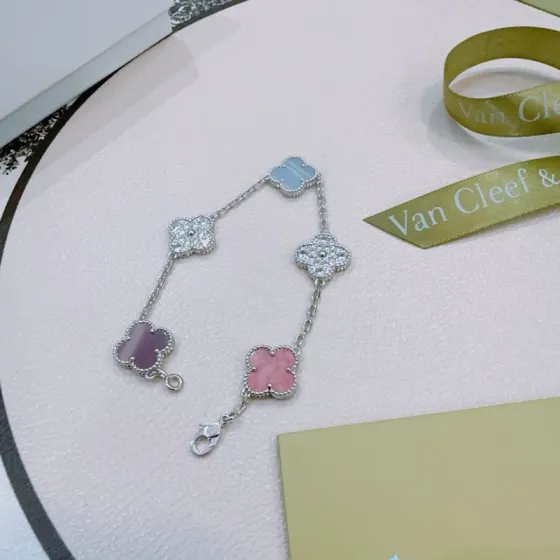 Van Cleef Arpels Alhambra bracelet Silver-toned metal with pink rhodonite purple chalcedony light blue chalcedony and clear diamond-paved clover motifs 17cm