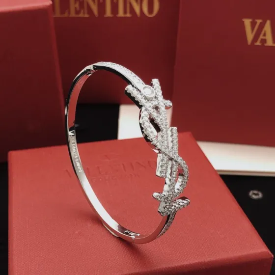 Saint Laurent Cassandre Monogram Pave Bangle bracelet silver-toned metal with clear pave crystals 17cm inner circumference