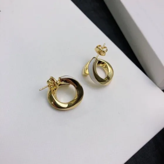 Celine Twisted Hoop Stud Earrings earrings gold-tone metal with white enamel accent 1 5cm diameter