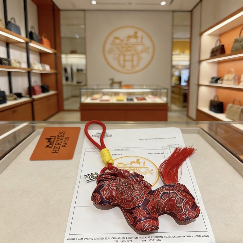 Hermes Rodeo Horse Charm pendant Red patterned silk fabric with silver-tone metal hardware red cord yellow cord wrap red tassel 10cm total length