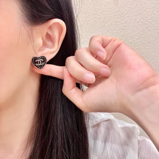Chanel CC Heart Stud Earrings earrings light gold tone metal with black enamel and silver-tone interlocking CC logo 1 5cm diameter