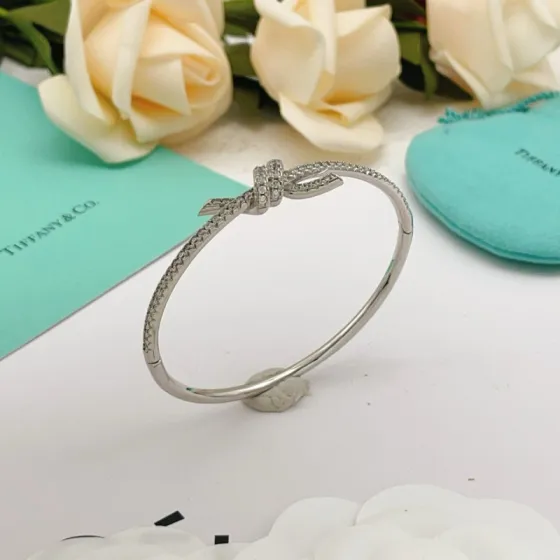 Tiffany Co Knot bracelet silver-toned metal with clear diamond accents 17cm inner circumference