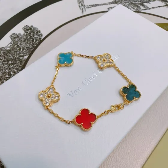 Van Cleef Arpels Alhambra bracelet Gold metal with red turquoise blue teal blue and clear diamond-accented four-leaf clover motifs 17cm