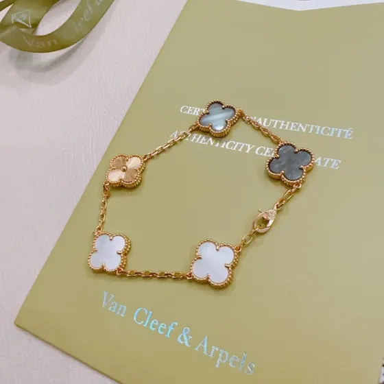Van Cleef Arpels Alhambra bracelet Rose gold metal with white mother-of-pearl gray mother-of-pearl and rose gold guilloche clover motifs 19cm