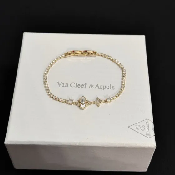 Van Cleef Arpels Alhambra bracelet yellow gold with clear diamond accents and mother-of-pearl detail 17cm