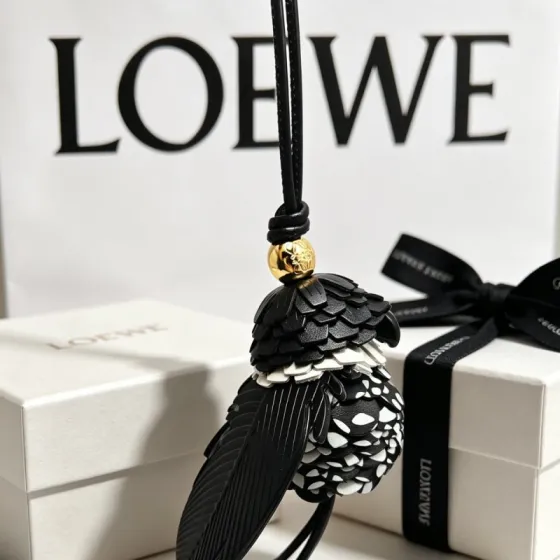 Loewe Anagram Bird Charm pendant Gold-tone metal accent black and white polka dot leather black leather cord 18cm total strap length