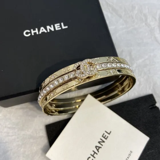 Chanel CC Logo Quilted Crystal Stacked Bangle bracelet gold-tone metal with clear crystal accents 17cm inner circumference