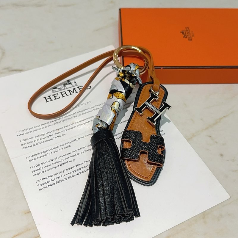 Hermes Oran Sandal Tassel Bag Charm pendant Gold-tone metal black leather tan leather silver-tone crystal H hardware multicolor printed silk 12cm total length