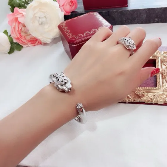 Cartier Panthere de Cartier bracelet 18k white gold 18k rose gold pave diamonds emerald eyes black onyx accents 17cm