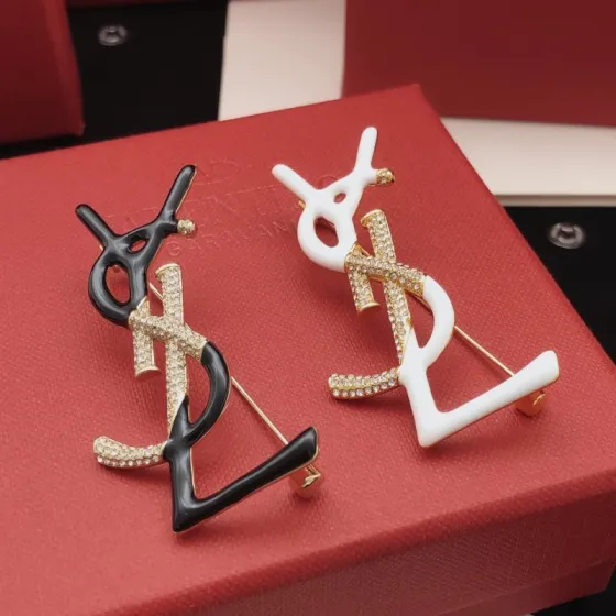 Saint Laurent Cassandre Monogram Brooch brooch gold-tone metal with clear pave crystals available in black enamel and white enamel variants 4 5cm height
