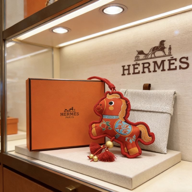 Hermes Chinese New Year Horse Charm pendant Red fabric with gold embroidery gold metal hardware red cord and tassels blue embroidered accents 12cm total length with strap