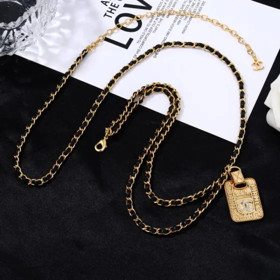 Chanel Goose series necklace gold-tone metal with black leather woven chain clear crystal accents on gold-tone pendant 80cm