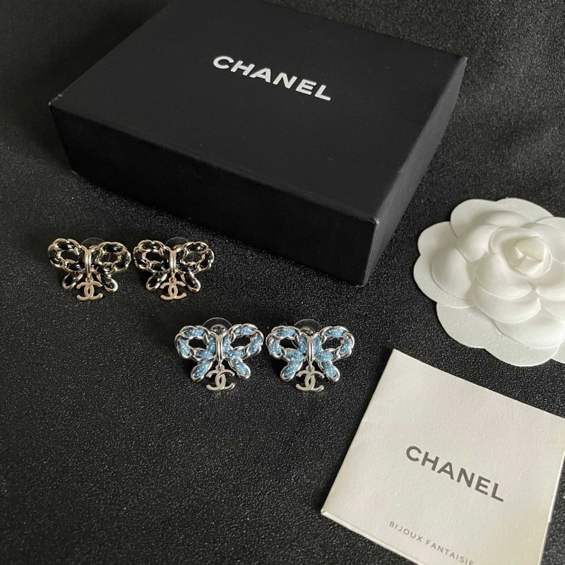 Chanel CC Bow Drop Earrings earrings Silver-tone metal with blue enamel and white dot detailing Gold-tone metal with black enamel detailing One Size 2cm width