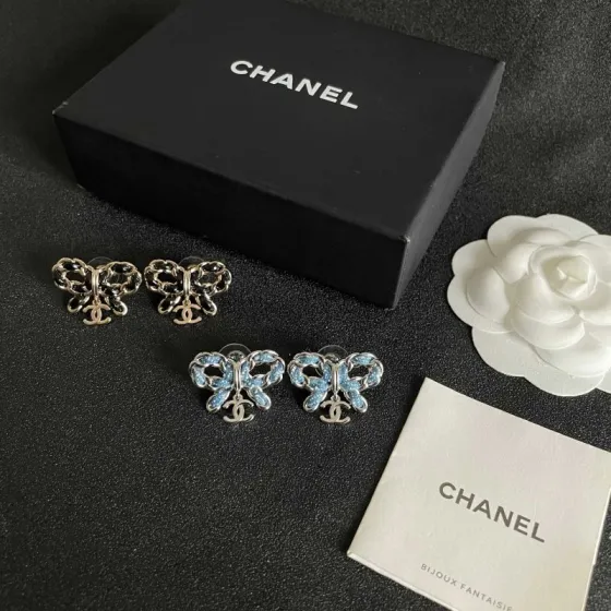 Chanel CC Bow Drop Earrings earrings Silver-tone metal with blue enamel and white dot detailing Gold-tone metal with black enamel detailing One Size 2cm width