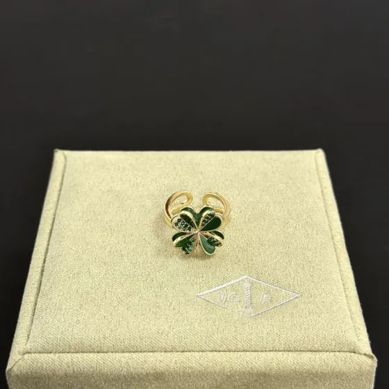Van Cleef Arpels Cosmos Four-Leaf Clover ring yellow gold metal with green enamel and green pave stones adjustable open band