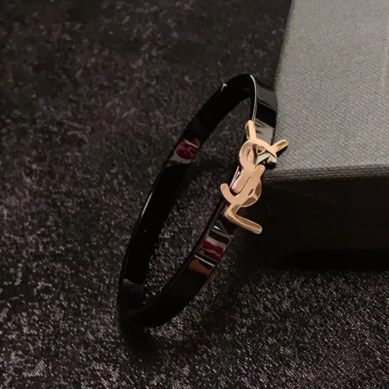 Saint Laurent Cassandre YSL Monogram bracelet black enamel band with gold-tone metal logo 17cm inner circumference