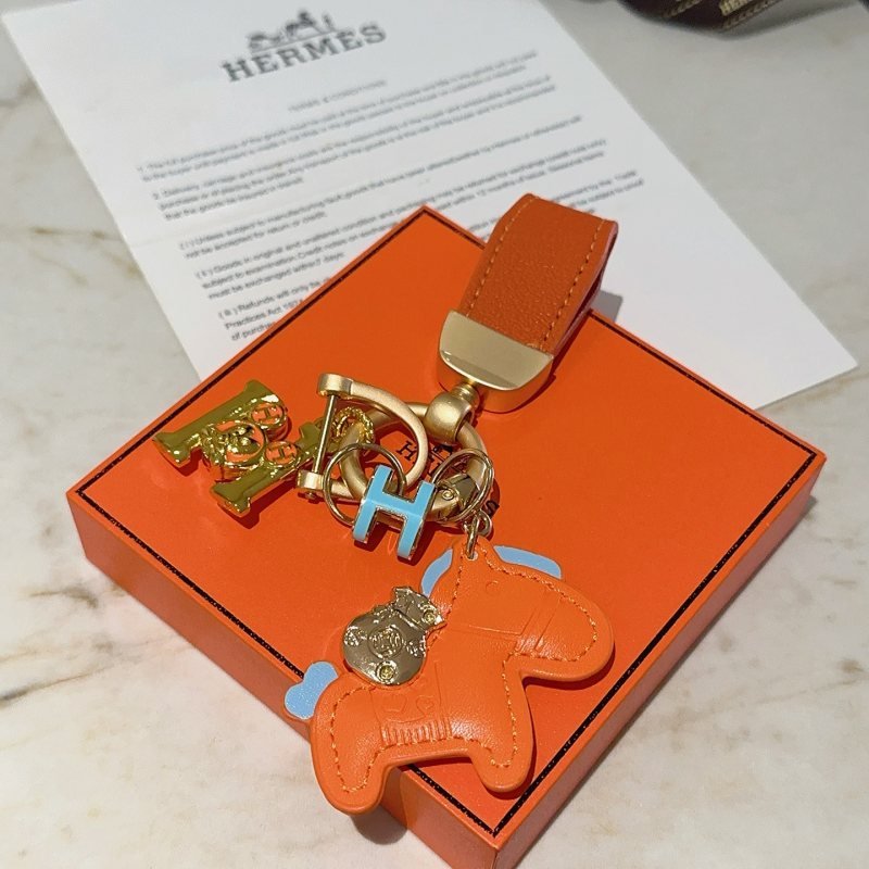Hermes Rodeo Horse Charm Keychain pendant Orange leather with light blue accents gold-tone metal hardware 10cm total length