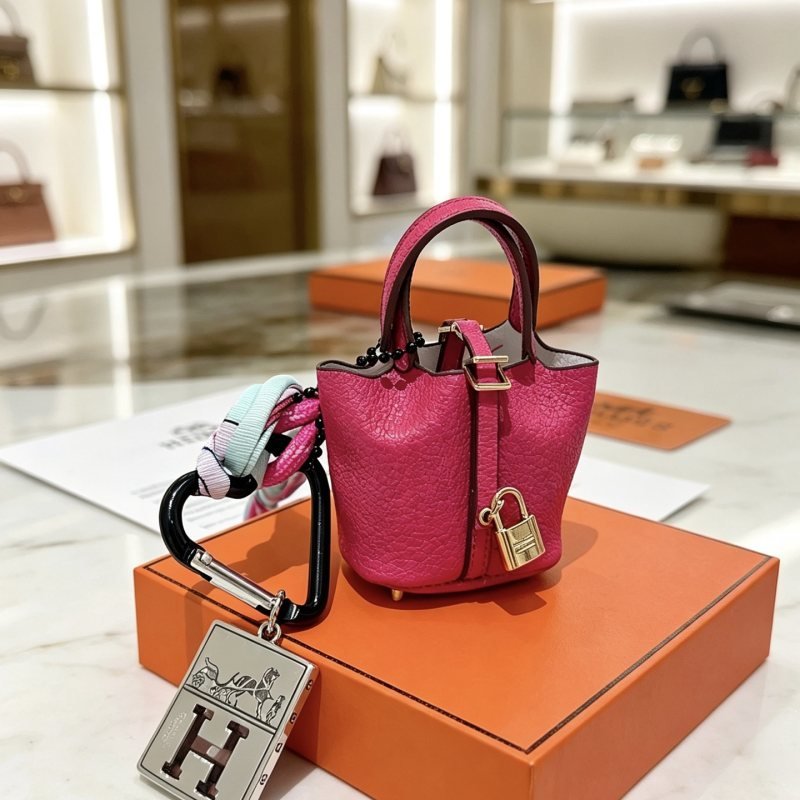 Hermes Mini Picotin Bag Charm with H Logo Tag pendant Hot pink grained leather with gold-tone hardware silver-tone H logo tag black carabiner multicolor braided strap black beaded chain Total length 12cm