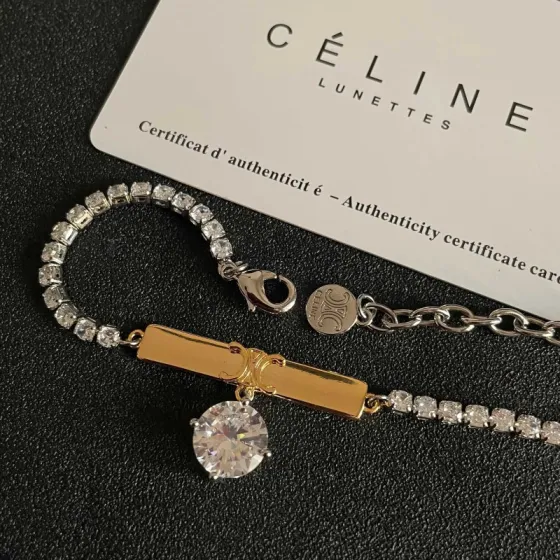 Celine Triomphe Crystal Charm Bracelet bracelet Two-tone gold and silver metal with clear faceted crystal stones 16cm with 5cm extender chain