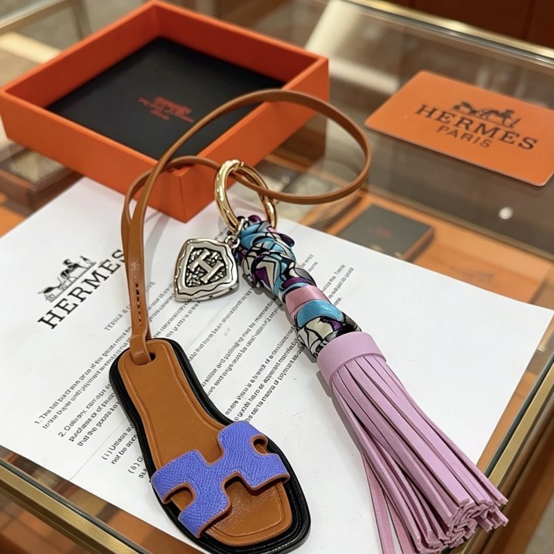 Hermes Oran Sandal Tassel Key Charm pendant Gold-tone metal brown leather lavender purple leather purple blue white printed silk silver-tone H charm 18cm strap length