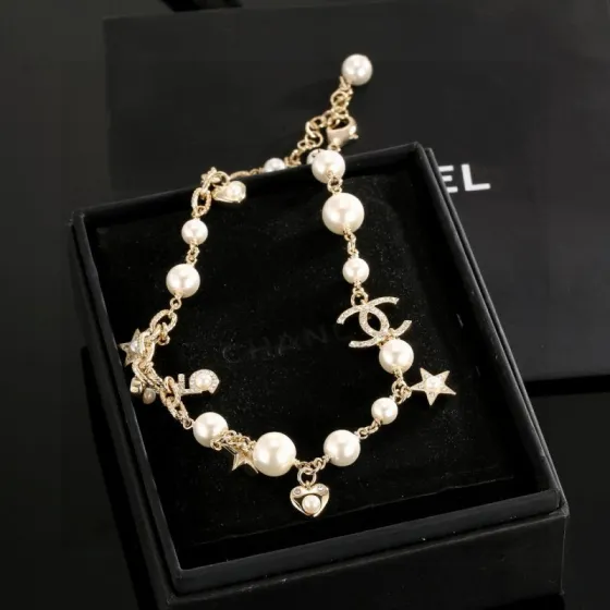 Chanel CC Charm Pearl Star Heart Necklace necklace Gold-tone metal cream white faux pearls clear crystal accents 42cm with 5cm extender