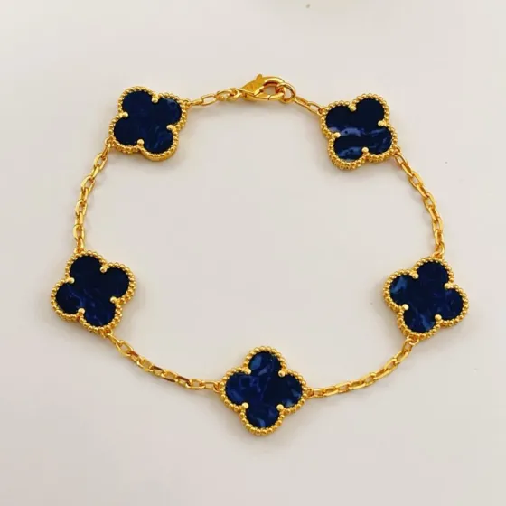 Van Cleef Arpels Alhambra bracelet Yellow gold with dark blue pietersite stone inlays 18cm