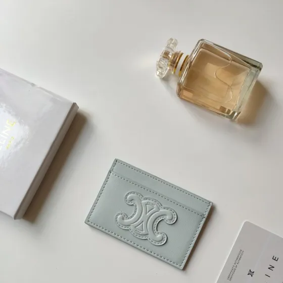 Celine Triomphe card holder pale ice blue smooth leather matching tone-on-tone embossed Triomphe logo light contrast stitching 10 5 x 7cm