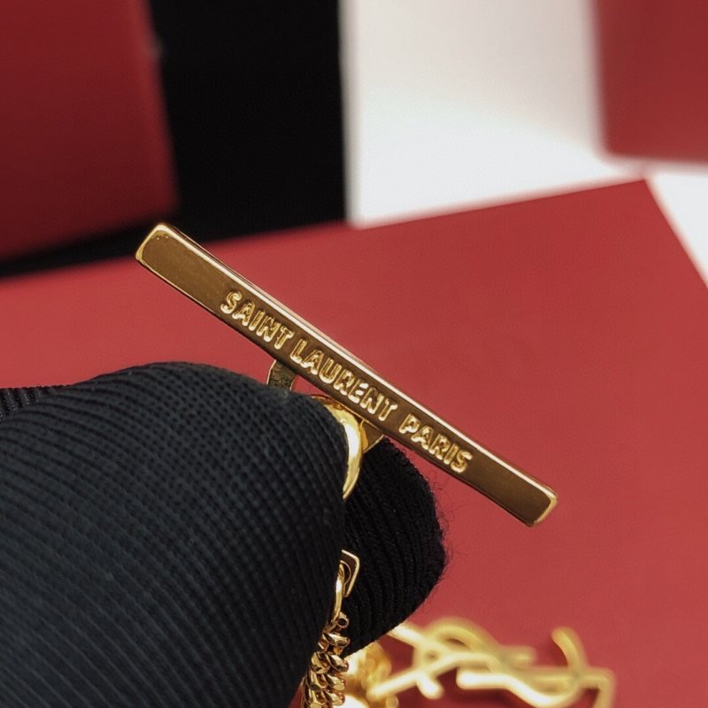 Saint Laurent Cassandre Multi-Charm Toggle Bracelet bracelet gold-tone metal with clear baguette-cut crystal accents 19cm