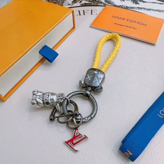 Louis Vuitton Anger Forest Keychain pendant Yellow braided leather gunmetal hardware silver bull charm with green enamel detail red enamel LV logo charm 10cm