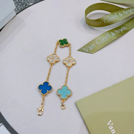 Van Cleef Arpels Alhambra bracelet Yellow gold metal with green malachite blue agate turquoise and clear diamond accents 19cm
