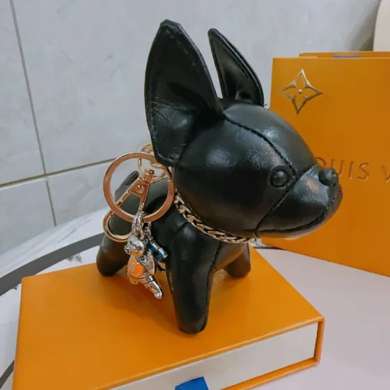 Louis Vuitton Anger Forest French Bulldog Keychain pendant black leather gold-tone metal silver-tone metal with orange and blue enamel accents 12cm plush charm with 5cm key ring