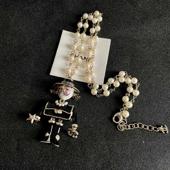 Chanel Coco Doll Pendant Necklace necklace Light gold tone metal cream faux pearls black enamel pink enamel accents 42cm with 5cm extender chain