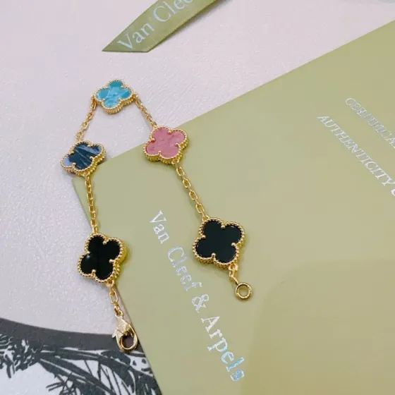 Van Cleef Arpels Alhambra bracelet Gold-toned metal with turquoise blue dark blue pink and black clover inlays 19cm
