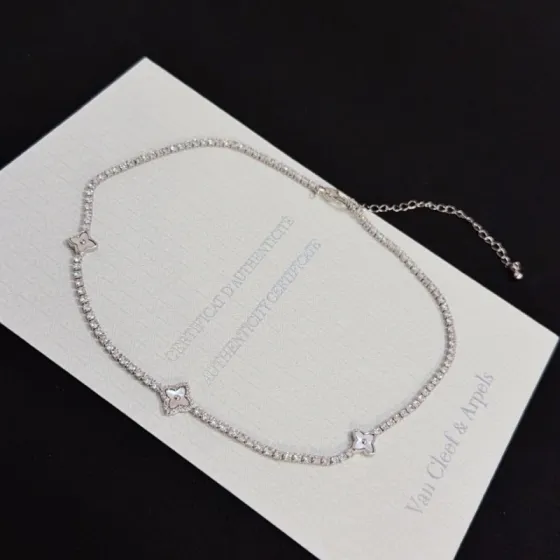 Van Cleef Arpels Alhambra necklace silver-toned white gold metal with clear diamond accents and mother-of-pearl clover motifs 42cm with 5cm extender chain