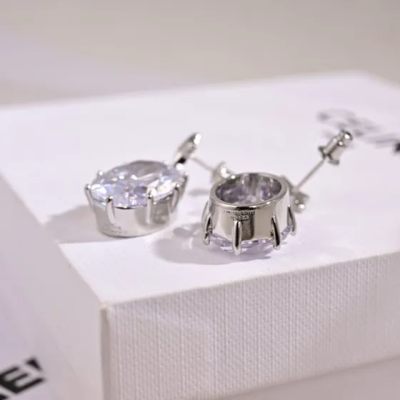 Celine Star Drop Oval Crystal earrings silver-toned metal with clear faceted crystal 2 5cm drop length