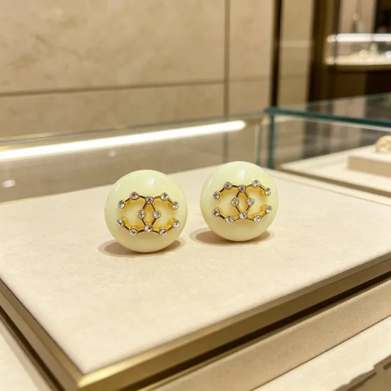 Chanel CC Logo Round Resin Stud Earrings earrings Cream ivory resin gold-tone metal clear crystal rhinestones 2 5cm diameter