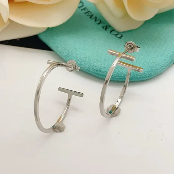 Tiffany Co T Wire Hoop earrings silver-toned metal available in yellow gold rose gold variants no gemstones 25mm hoop diameter