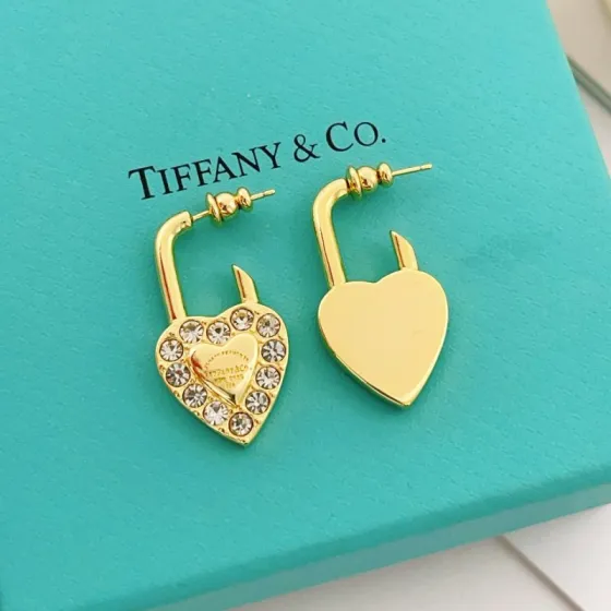 Tiffany Co Return to Tiffany Heart Lock earrings Gold-tone metal with clear faceted crystals One Size