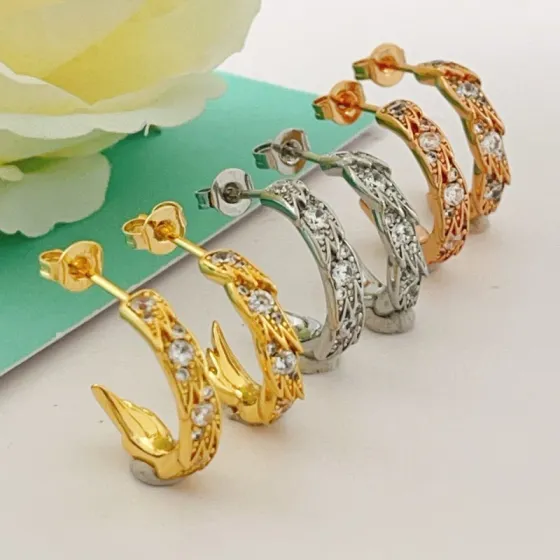 Tiffany Co Phoenix Tail Hoop Earrings earrings Gold-tone metal with clear round-cut cubic zirconia stones available in yellow gold rose gold and silver-tone metal finishes 15mm hoop diameter