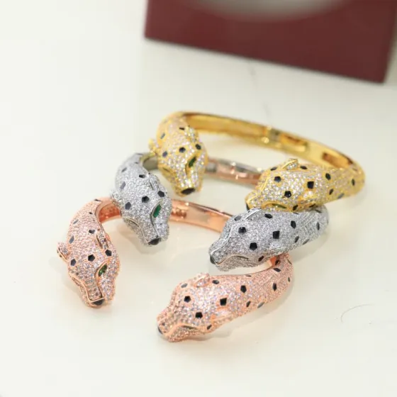 Cartier Panthere de Cartier bracelet 18K yellow gold 18K rose gold 18K white gold pave-set white diamonds black onyx spots emerald eyes black onyx nose 17cm