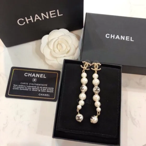 Chanel CC Logo Graduated Pearl Drop Earrings earrings Gold-tone metal white faux pearl clear crystal black enamel CC logo 6 5cm drop length