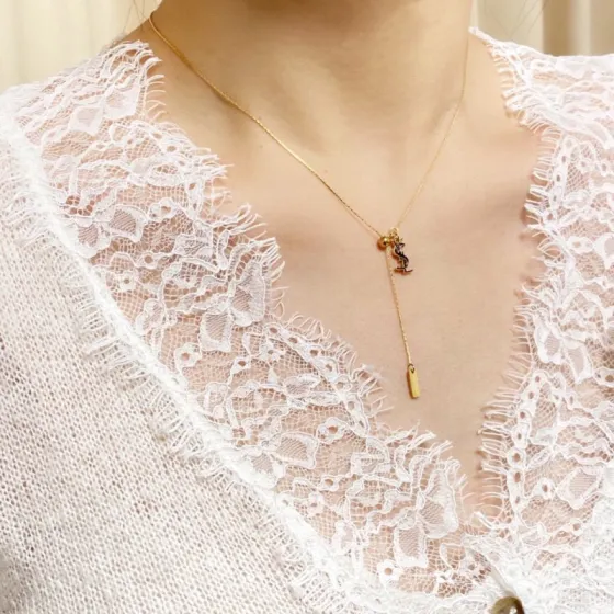 Saint Laurent Cassandre YSL Lariat necklace gold-tone metal with black enamel logo detail 40cm with 5cm extender
