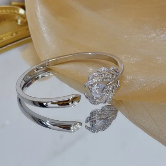 Piaget Feather Diamond Open Bangle bracelet silver-toned white gold metal with clear diamond and pear-shaped clear gemstone accents 17cm inner circumference
