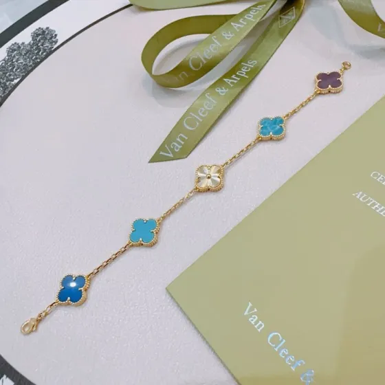 Van Cleef Arpels Alhambra bracelet Yellow gold with multicolor clover motifs including royal blue turquoise marbled blue purple and guilloche gold 18cm