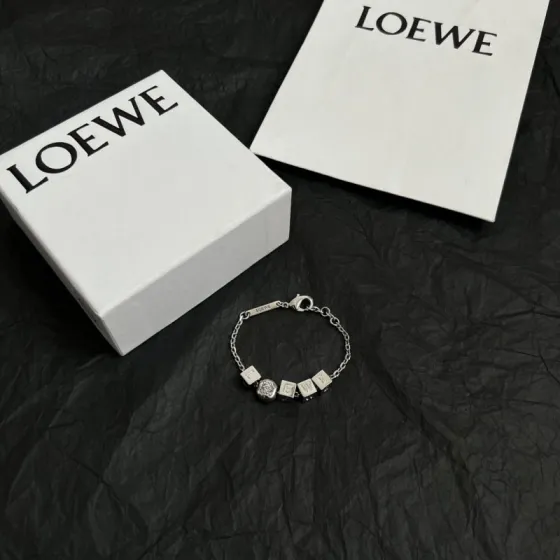 Loewe Anagram Dice bracelet Silver-tone metal with white enamel letter dice and embossed Anagram charm Gold-tone metal with gold-tone letter dice and embossed Anagram charm 18cm with 3cm extension chain