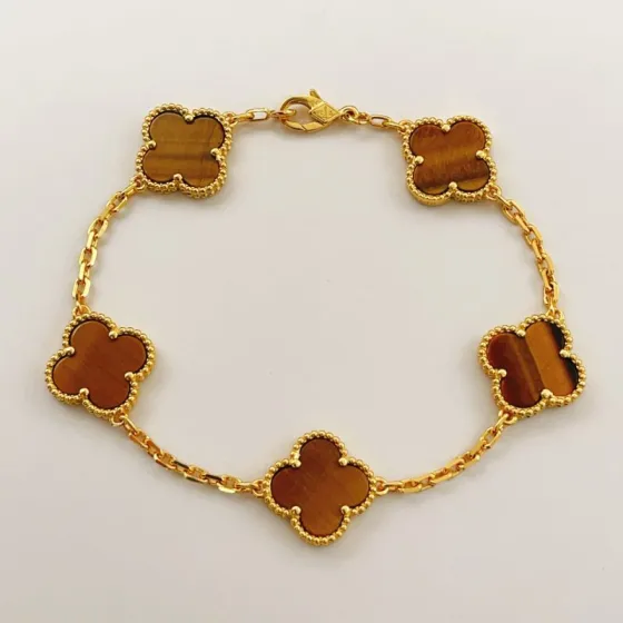 Van Cleef Arpels Alhambra bracelet Yellow gold with brown tiger s eye stone 19cm