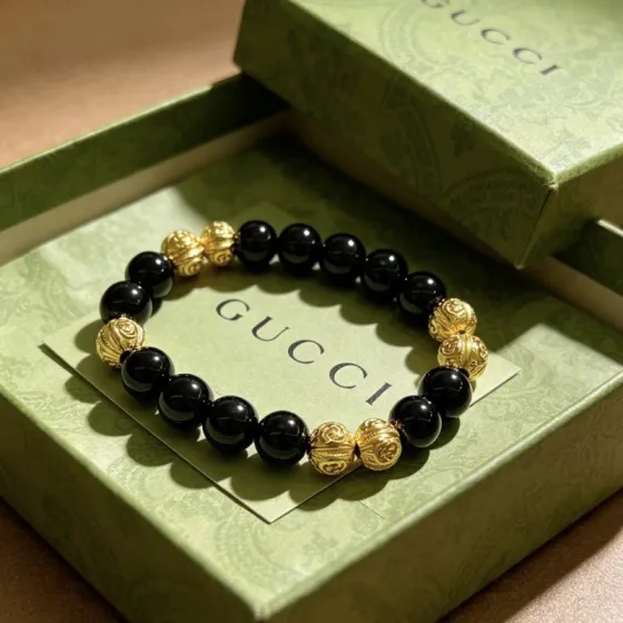 Gucci Anger Forest bracelet gold-tone metal with black onyx beads 18cm
