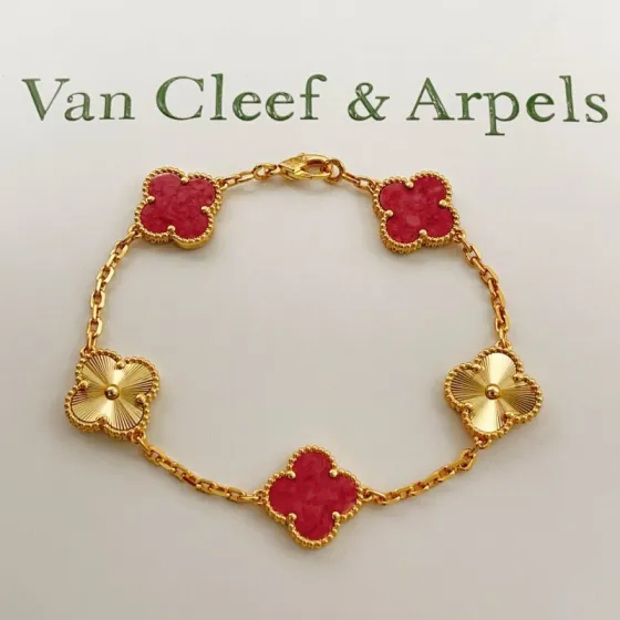 Van Cleef Arpels Vintage Alhambra bracelet Yellow gold with red stone inlays and guilloche gold motifs 18cm